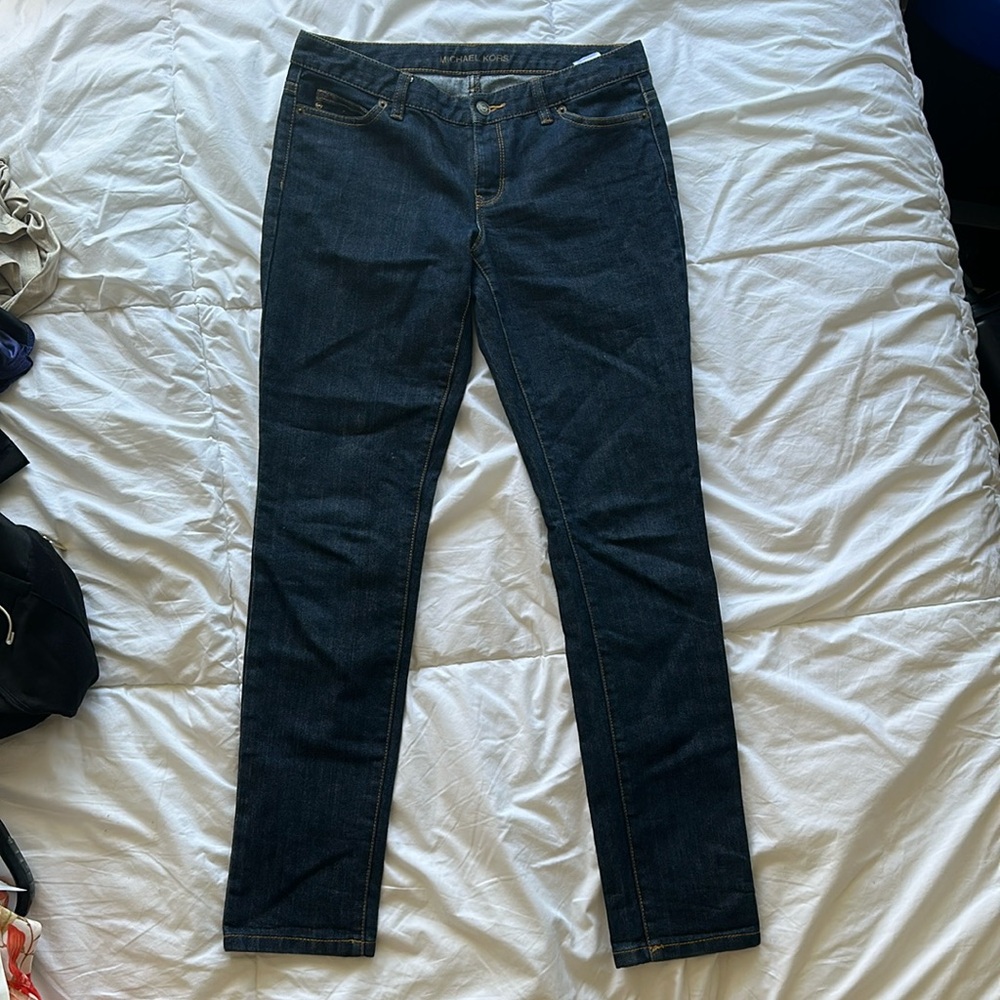 Michal Kors size 4, mid rise, straight leg, dark wash denim.